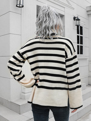 Flared sleeve striped turtleneck sweater in black and cream acrylic with a relaxed fit.
