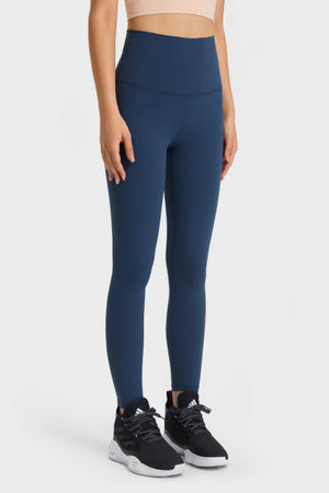 Navy high rise leggings with a smooth finish and a fitted silhouette.