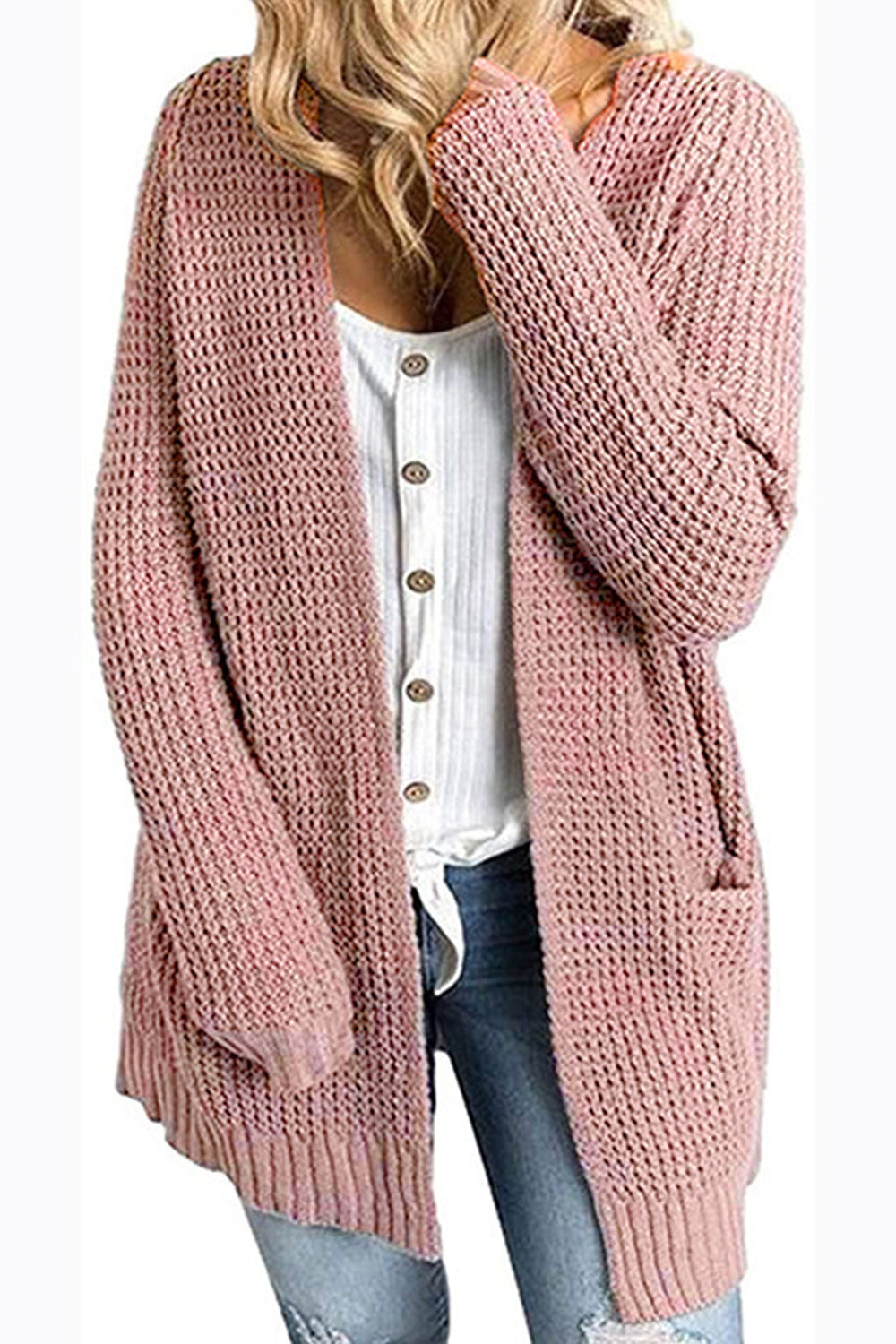 Dusty pink waffle knit longline cardigan with pockets and open front, worn over a white button-up shirt.