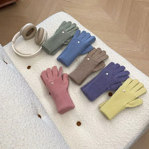 Convertible ribbed knit touchscreen gloves in multiple colors with button detail.