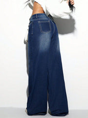 Dark wash cotton palazzo jeans with white contrast stitching and a wide leg.