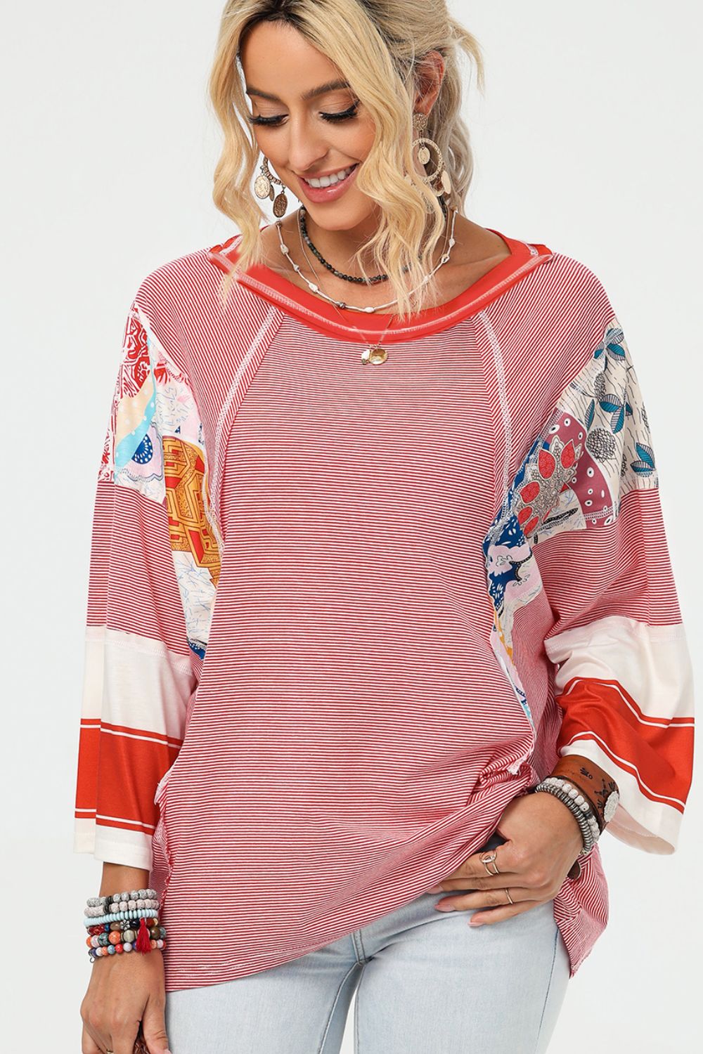Patchwork stripe raglan tee in deep red with boho print accents and a relaxed fit.
