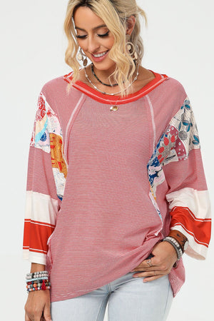 Patchwork stripe raglan tee in deep red with boho print accents and a relaxed fit.