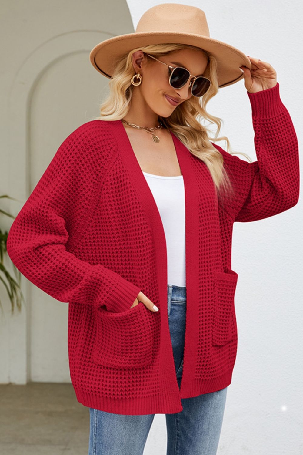 Deep Red waffle knit cardigan with patch pockets and open front.