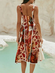 Midi dress with paisley print, lace trim, and square neckline.