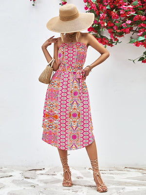 Printed bandeau midi dress with asymmetric hem and belt in hot pink.