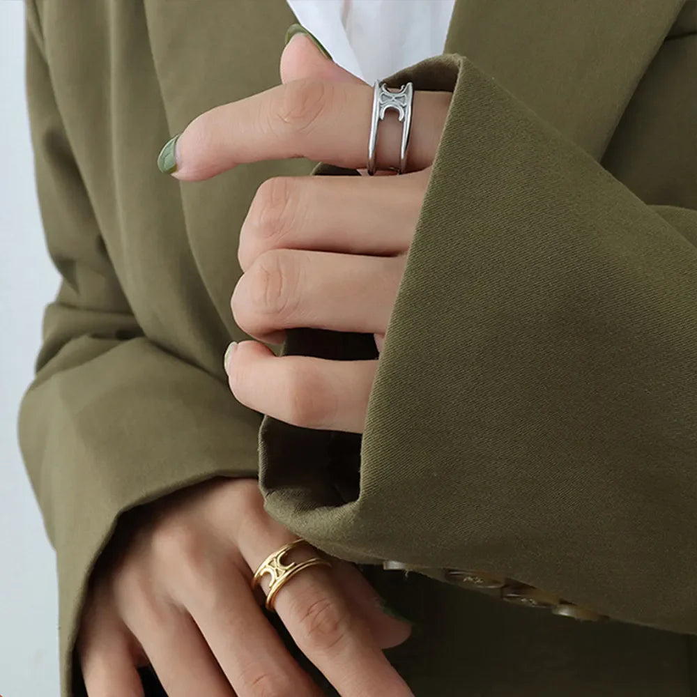 Double banded open ring in silver and gold, featuring a chic cutout design.