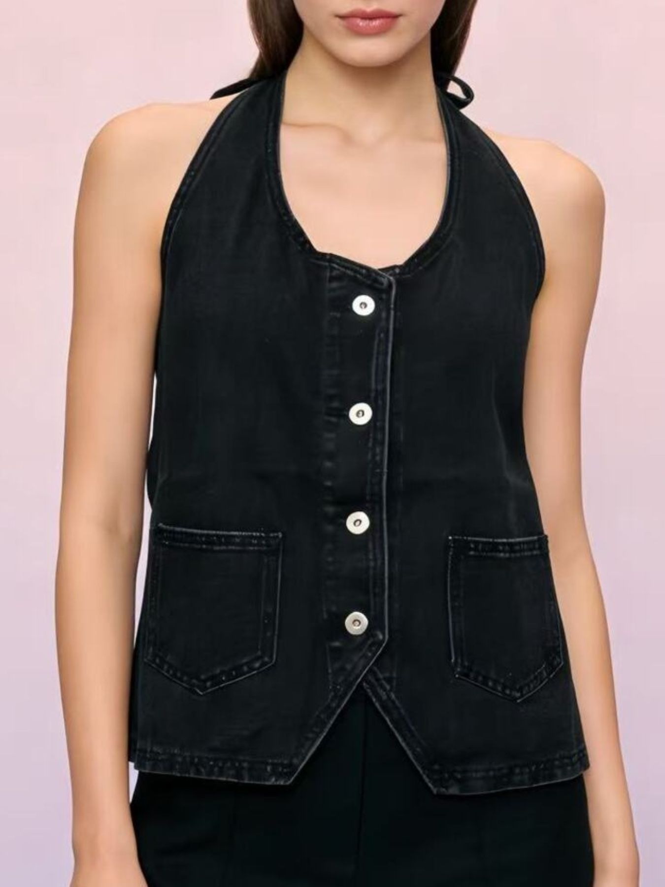 Black denim halter vest with button-down front and two chest pockets.