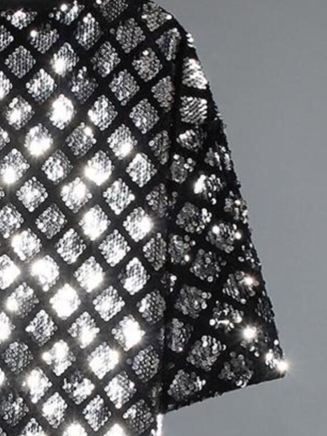 Men's black t-shirt with all-over silver diamond sequin pattern.