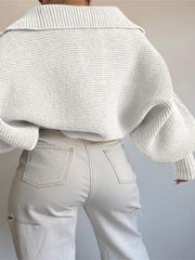 White wide collar balloon sleeve knit sweater with ribbed texture.