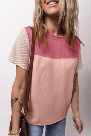 Ribbed tee with colorblock pink and textured beige sleeves.