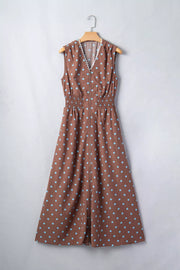 Brown polka dot midi dress with smocked waist and zipper closure