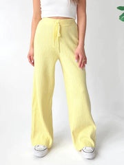 Luxe ribbed knit palazzo trousers in pastel yellow with drawstring waist.