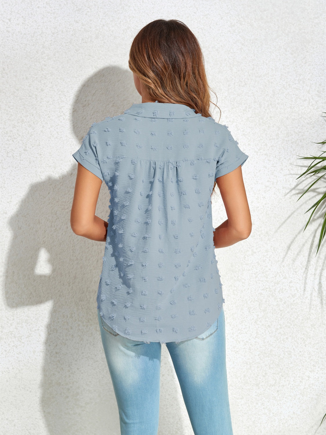 Light blue textured dot poplin shirt with short sleeves and a collared neckline.
