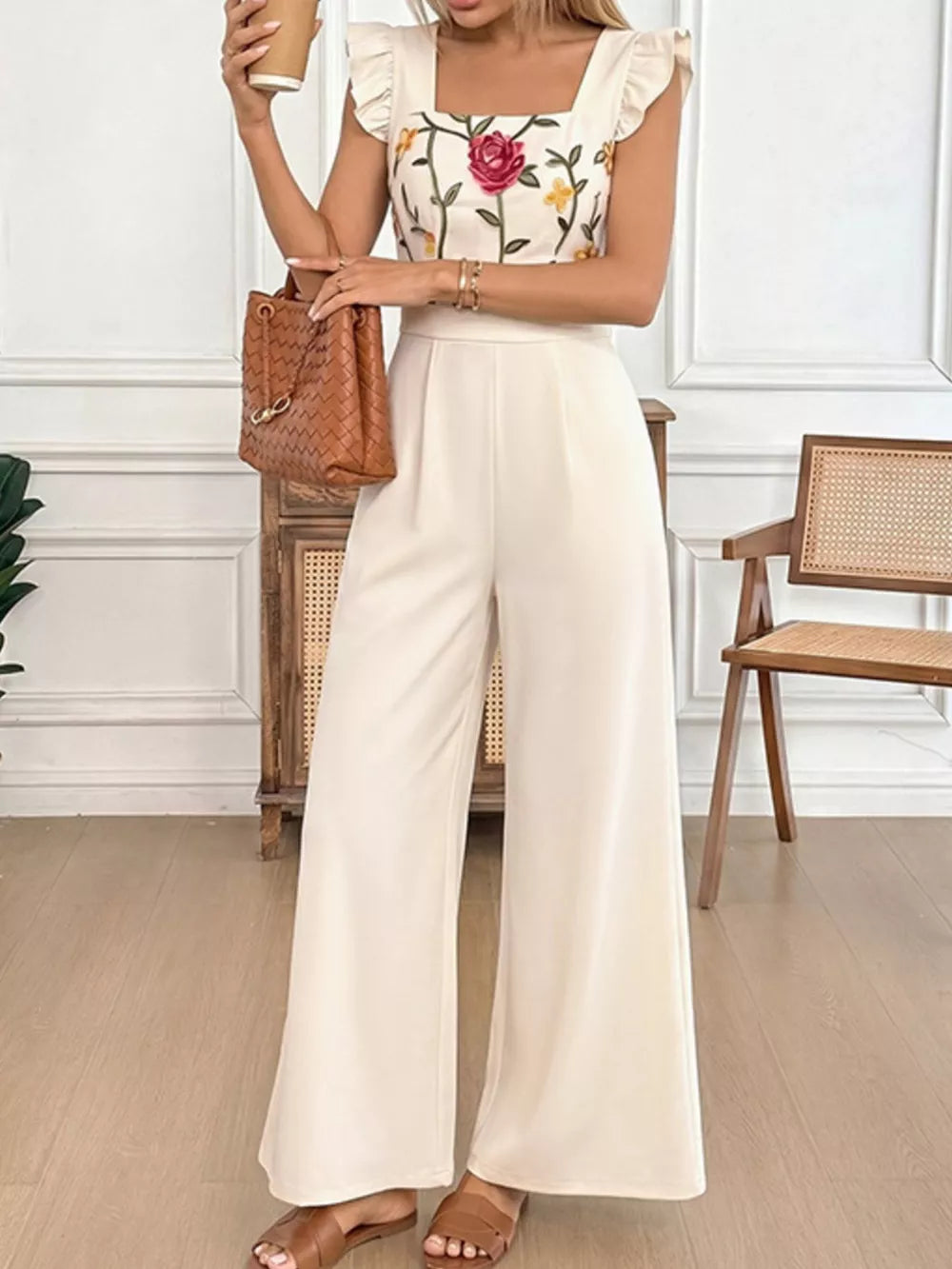 Floral embroidered square neck ruffle sleeve jumpsuit in beige with wide leg pants.