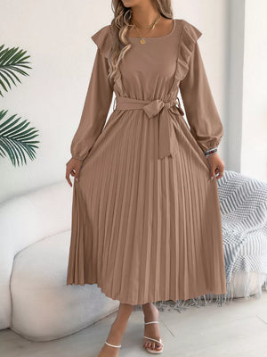 Khaki A-line midi dress with ruffled neckline, long sleeves, belted waist, and pleated skirt.