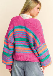 Chunky stripe balloon sleeve cardigan in pink with blue, green, and orange stripes.