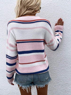 Pink pastel stripe crewneck knit sweater with white and blue accents.