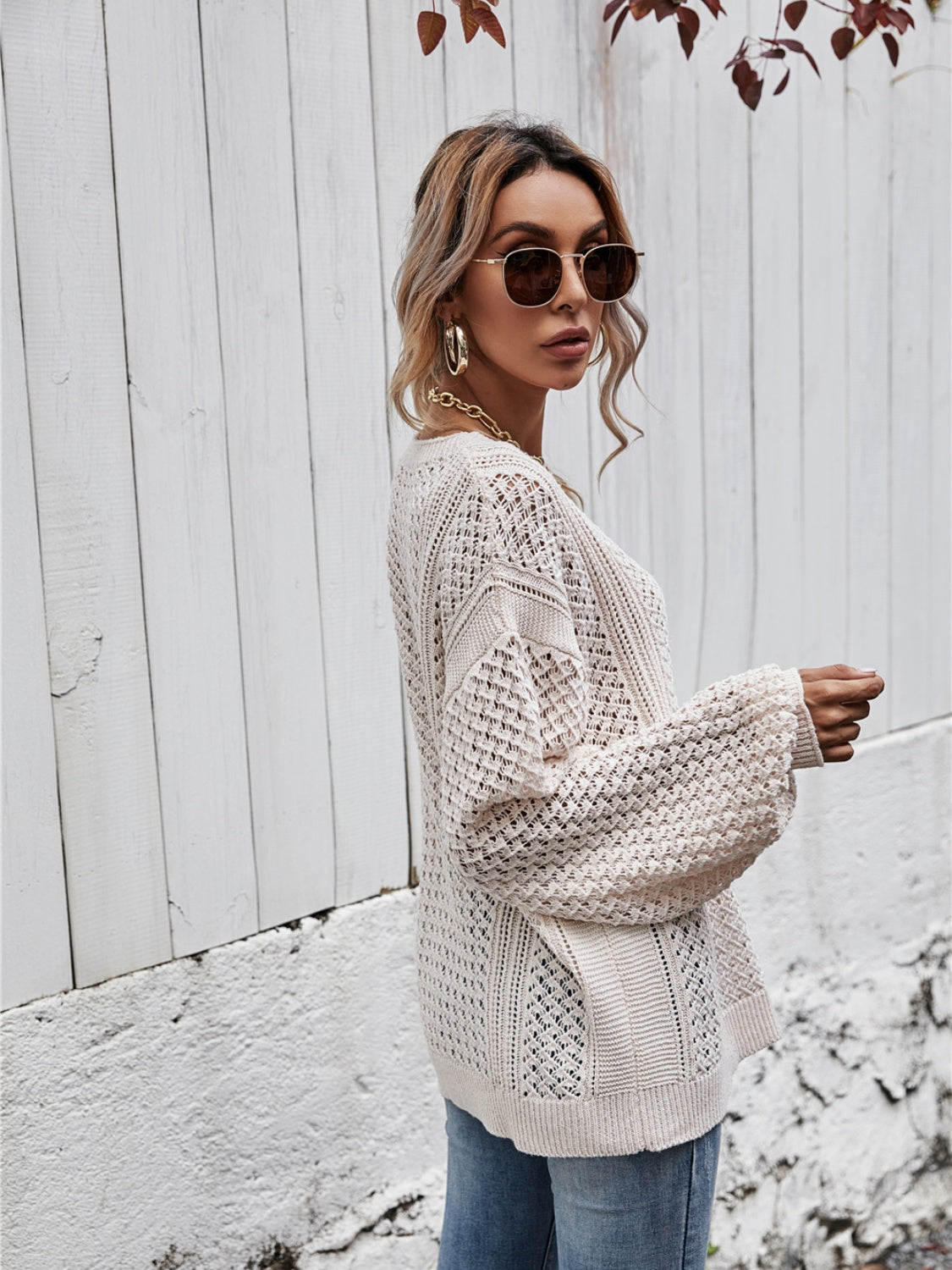 Open-knit sweater in Ivory with balloon sleeves and a relaxed fit.