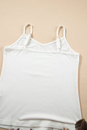 White cami with adjustable straps and V-neck detail.