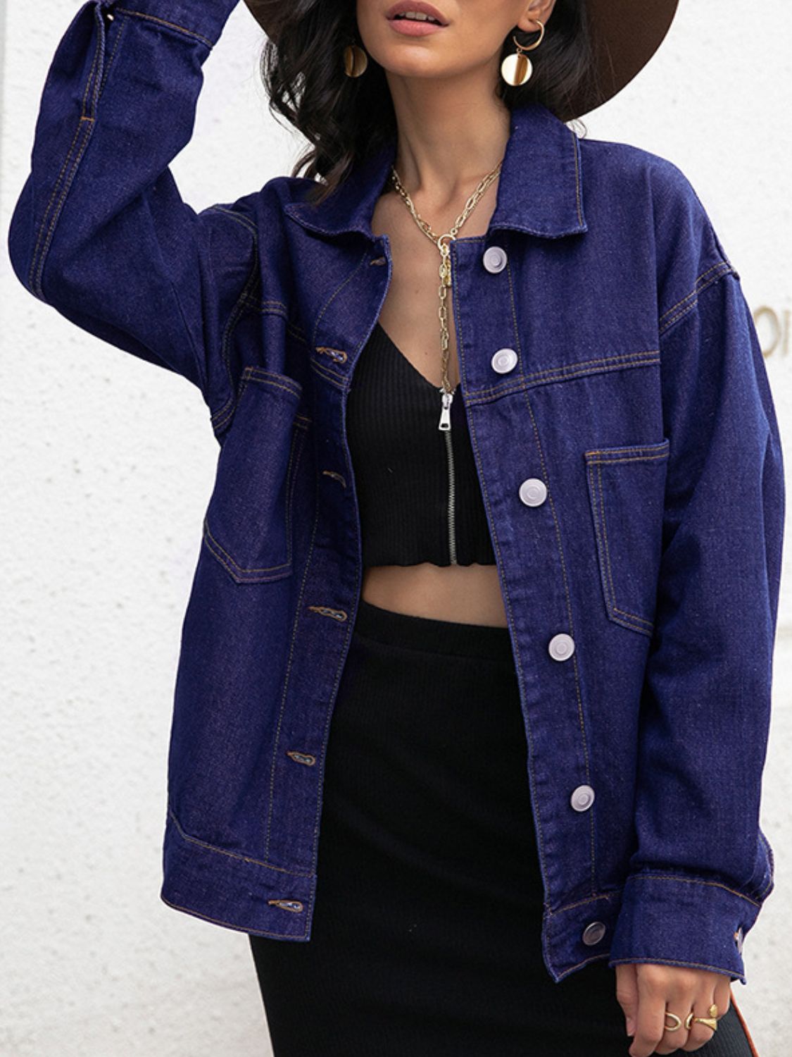 Oversized dark denim trucker jacket with contrast stitching and button front.