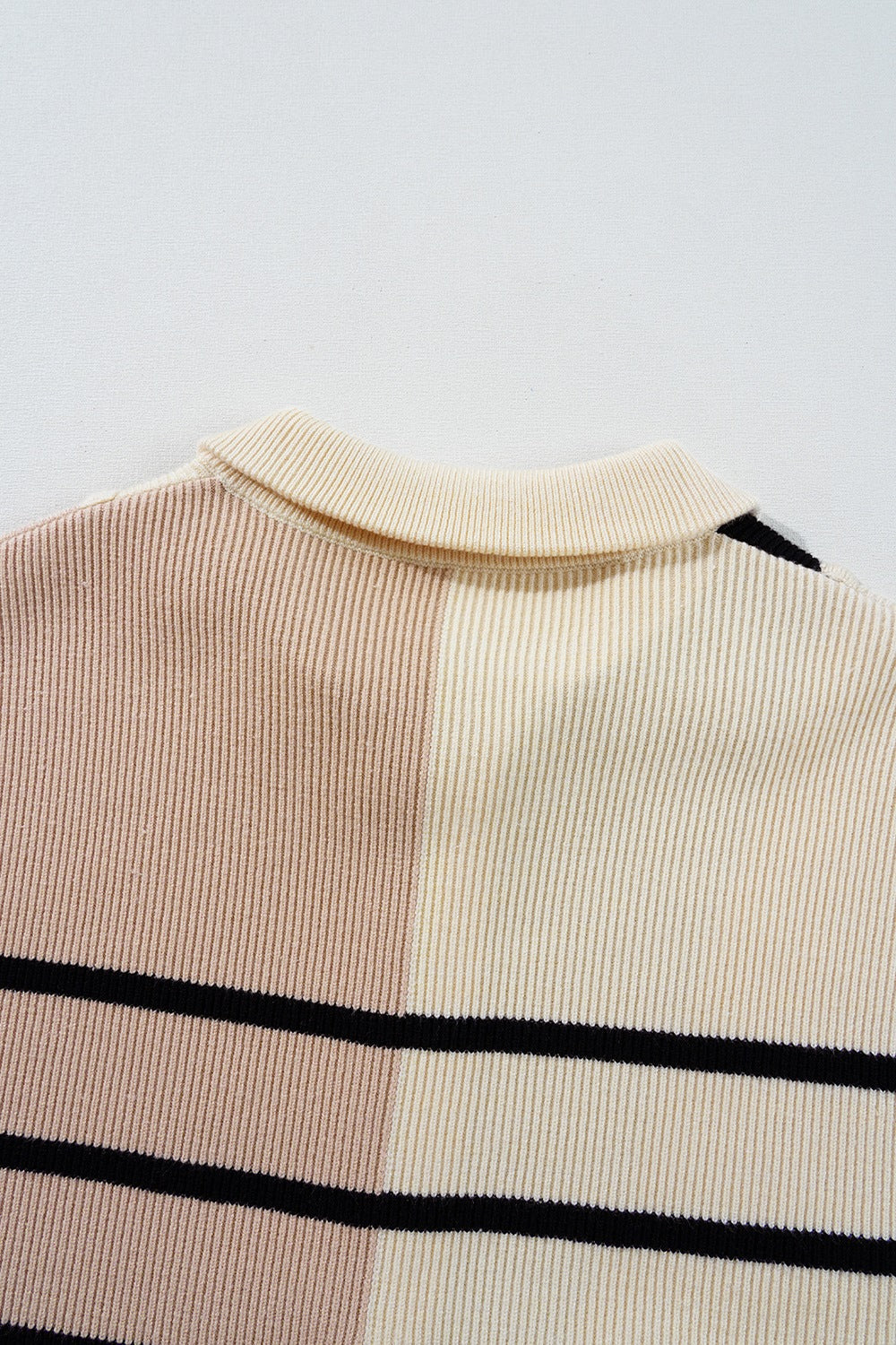 Colorblock ribbed mini dress with mock neck and horizontal stripes in beige and black.
