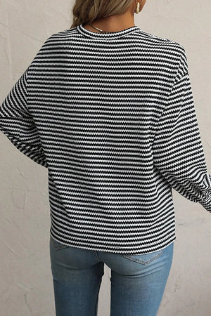 Black and white striped long sleeve tee with a crew neck, casual fit.