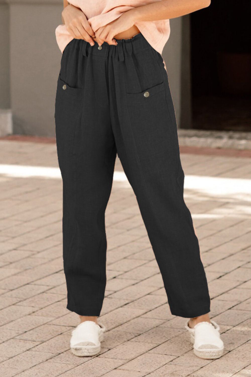 Black linen-blend trousers with button pockets and a relaxed fit