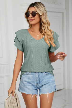Teal eyelet knit v-neck blouse with flutter sleeves and diamond pattern detail.