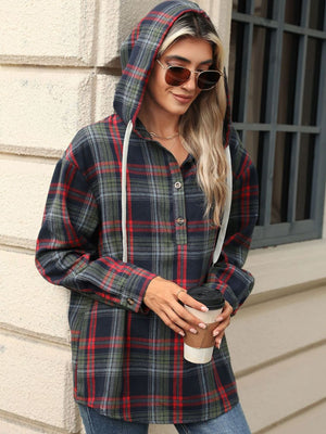 Plaid henley hooded shirt with buttoned placket and white drawstrings.