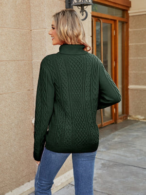 Green cable knit turtleneck sweater with detailed cable patterns.