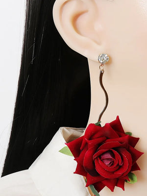 Deep red velvet rose cascade earrings with crystal stud and wavy gold-tone drop.