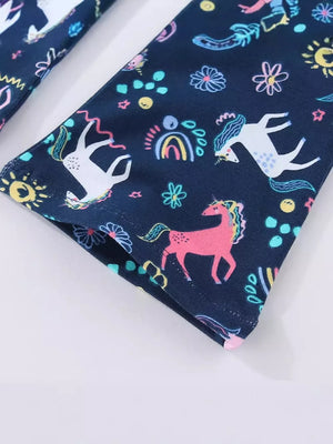 Toddler leggings with a navy blue background and a colorful unicorn and rainbow print.