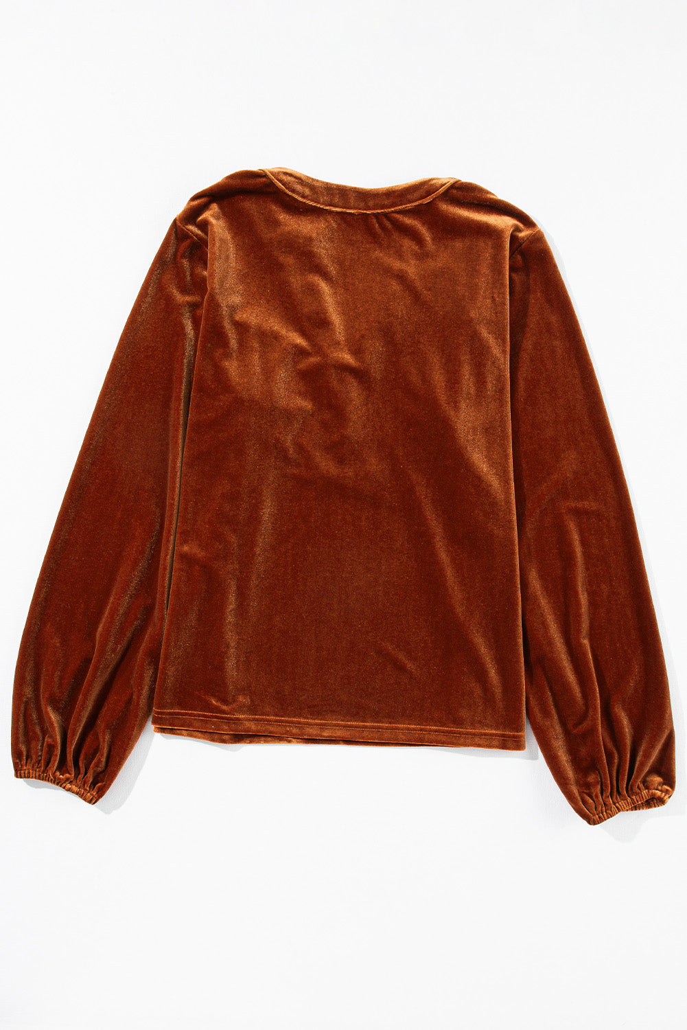 Gathered velvet henley blouse in brown with long balloon sleeves and gathered cuffs.