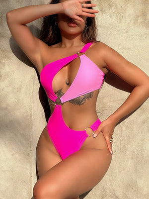 Hot pink one-shoulder swimsuit with cut-out and ring details