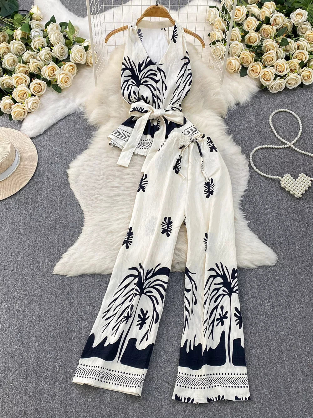 Tropical print sleeveless top and wide-leg pants set with belted detail in black and white polyester