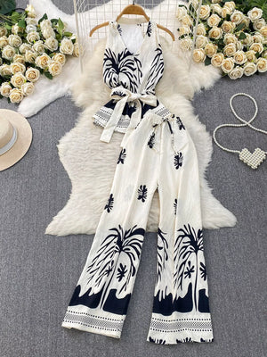 Tropical print sleeveless top and wide-leg pants set with belted detail in black and white polyester