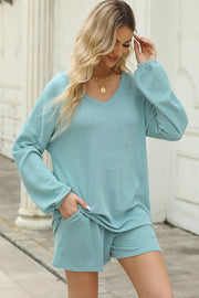 Pastel blue ribbed V-neck long sleeve top and matching shorts set with pockets.
