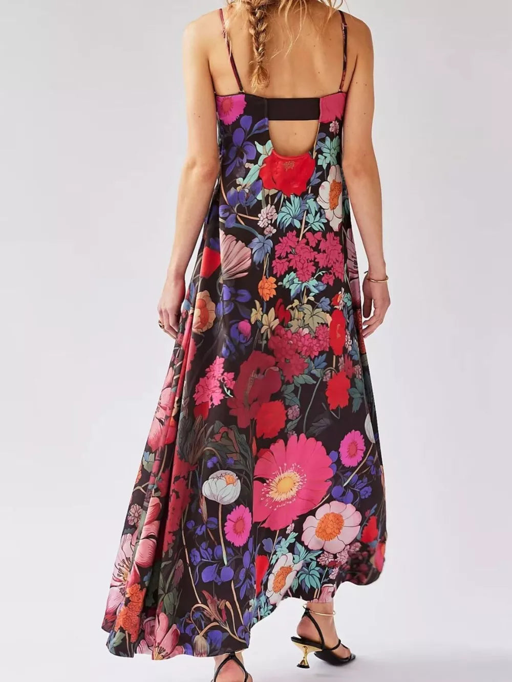 Maxi dress with vibrant floral print, gathered bodice, and open back detail.