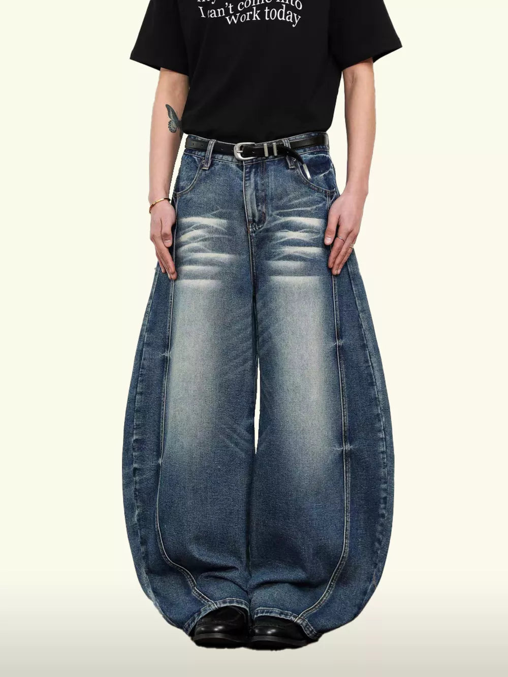 Belted wide leg denim jeans in light blue wash with balloon silhouette and 100% cotton.