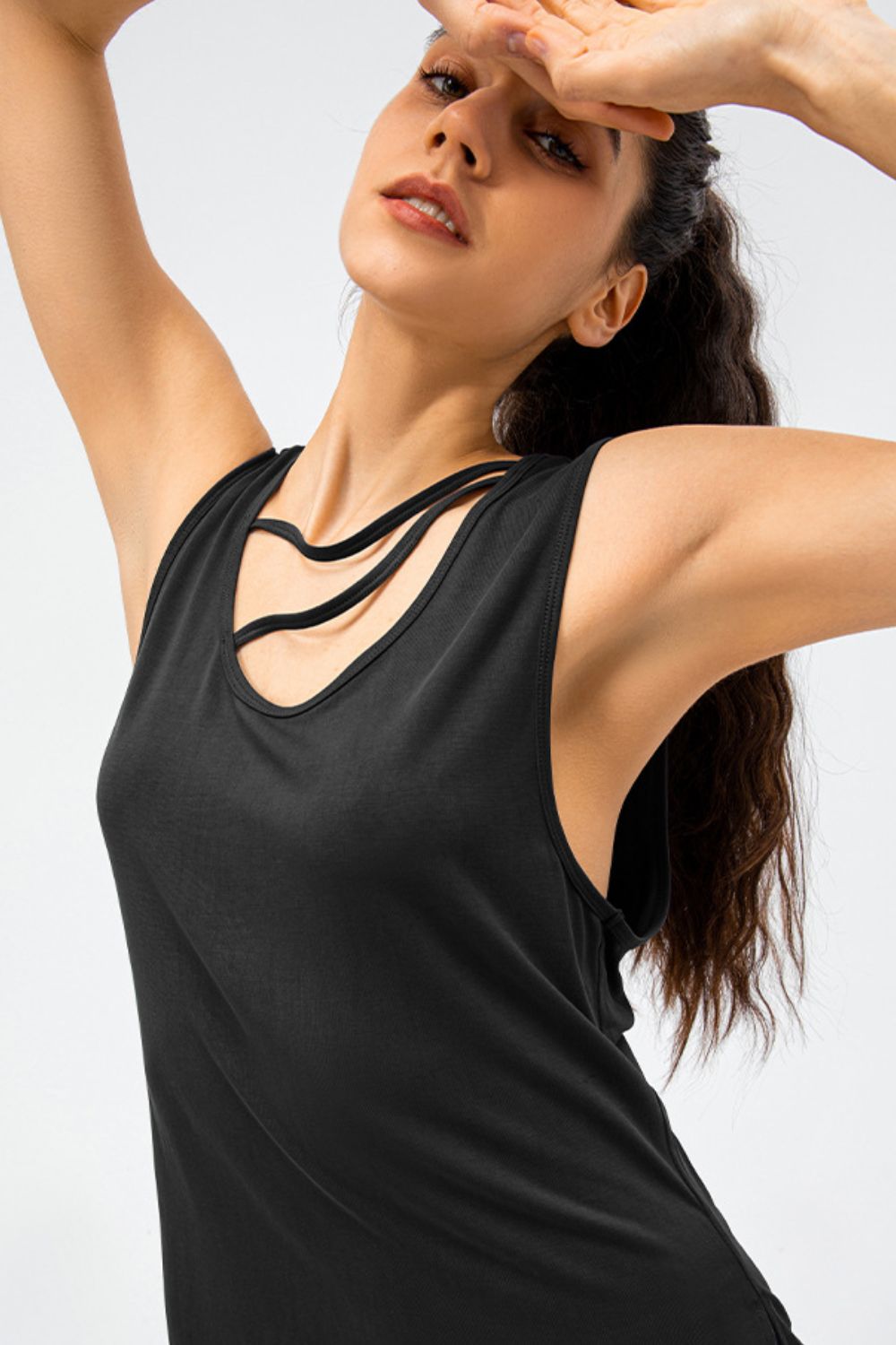 Black performance tank top with strappy neckline detail