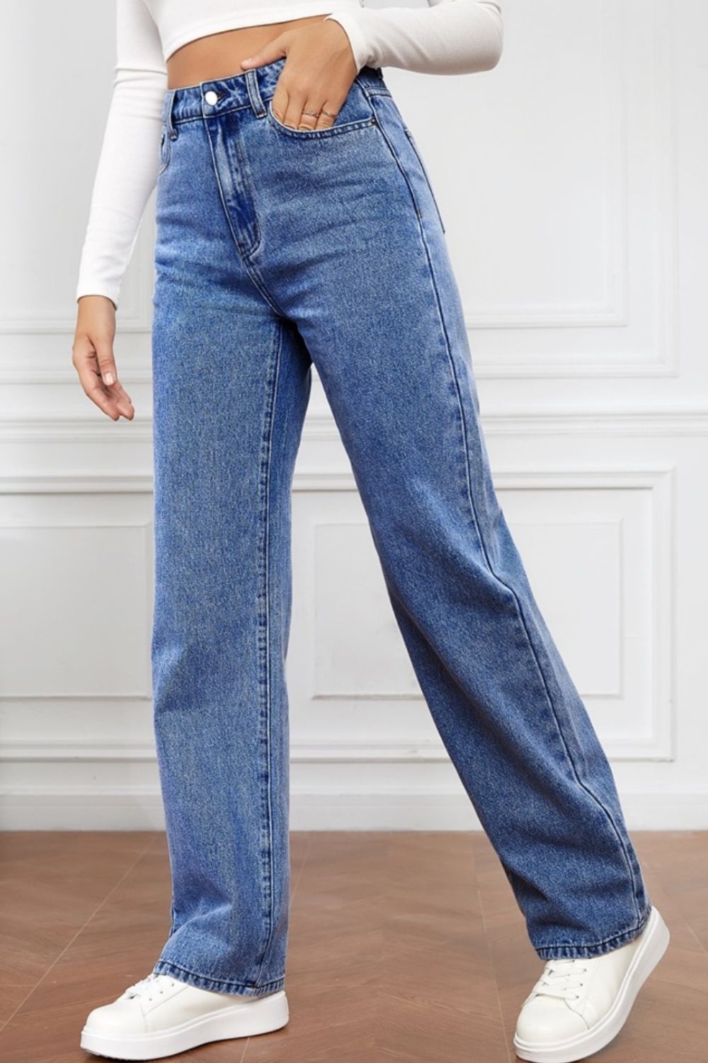 Light blue denim jeans with a wide-leg cut and high rise, styled casually.
