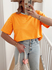 Tangerine and yellow striped cotton t-shirt with round neck and short sleeves.