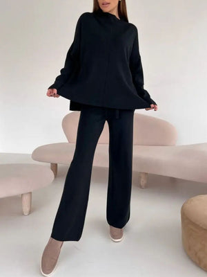 Black relaxed fit knit co-ord set with mock neck top and wide leg pants.