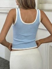 Blue knit tank top with white trim and scalloped hem