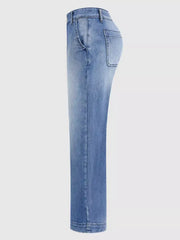 Relaxed high-waisted denim maternity jeans in light blue wash with cuffed hem and pockets.