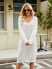 White textured knit midi dress with V-neck and long sleeves.
