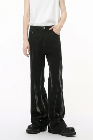 Faded flare denim jeans in dark wash with distressed detailing and a relaxed fit.