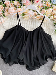Black ruffled camisole with spaghetti straps and a flowy hem.
