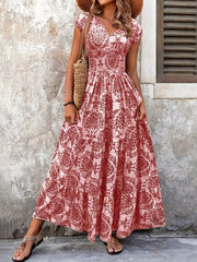 Red damask print maxi dress with cap sleeves and tiered skirt.